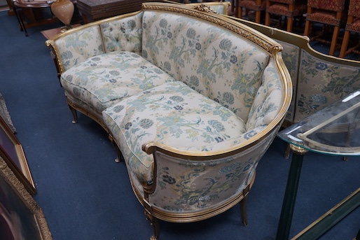 A pair of contemporary Louis XVI style gilt framed tub shaped settees with loose cushion seats, length 210cm, depth 65cm, height 95cm